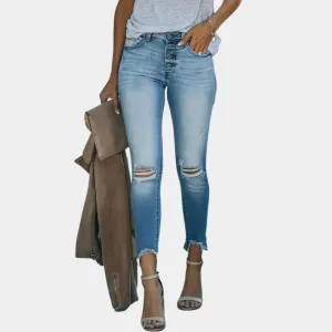 Abolins - Torn women's jeans with buttons.